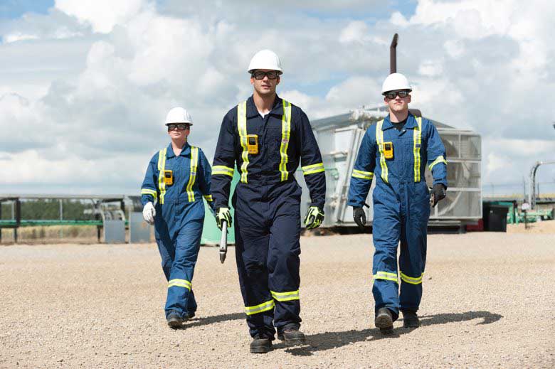 Three workers walking